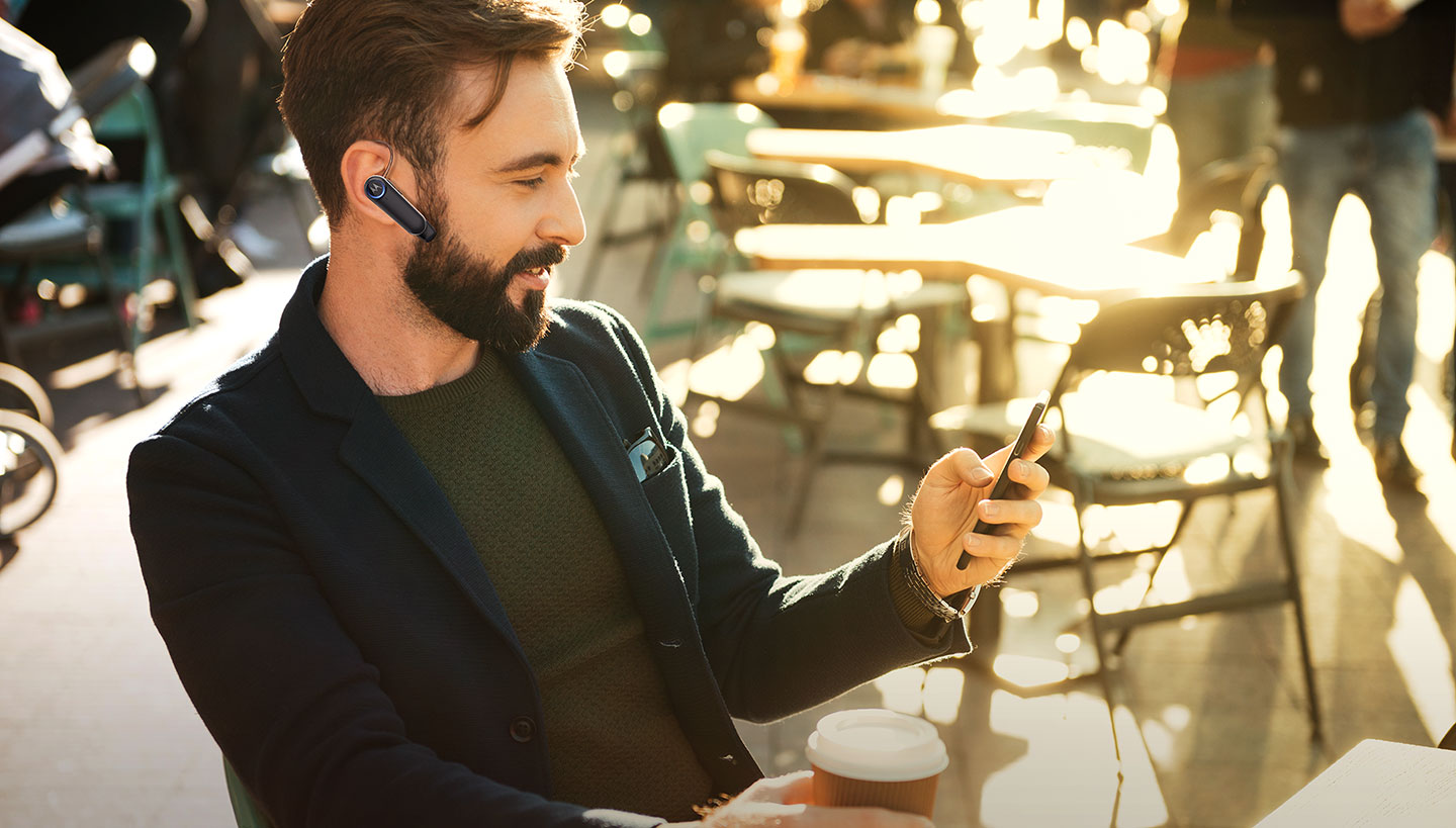 Subject enjoying HK500 mono headset with all day power to keep you connected