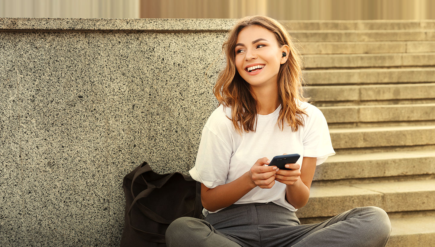 Subject enjoying MOTO Buds 120's maximum connectivity