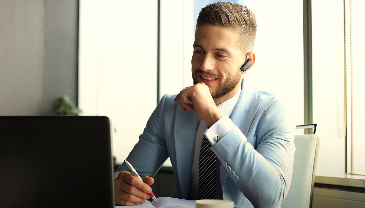 Subject enjoying HK375-S wireless mono headset with Multipoint connectivity